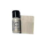 Distress Paint bottle with a swatch of wood grain color on a white background