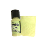 Bottle of Tim Holtz Distress Paint with a swatch on a white background