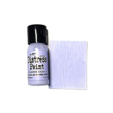 Distress Paint bottle with a swatch of applied color on a white background