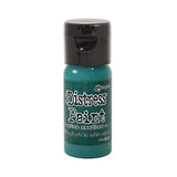 Green bottle of Ranger Distress Paint on a white background