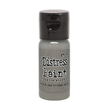 Bottle of Tim Holtz Distress Paint on a white background